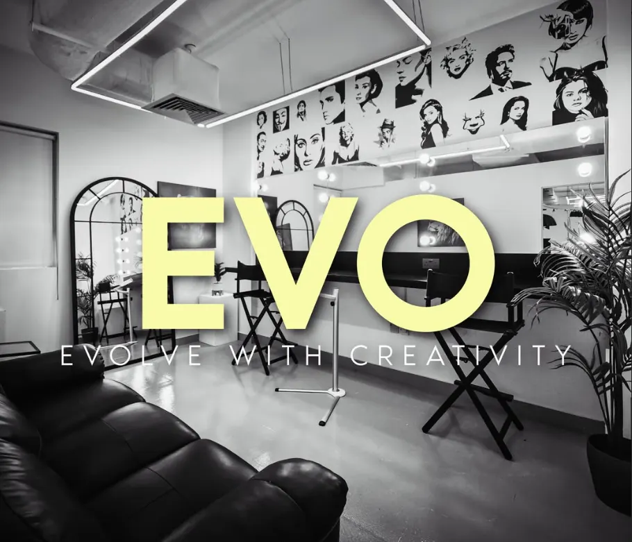 Brand slide reading EVO, Evolve With Creativity, over the studio lounge and its wall of portrait prints